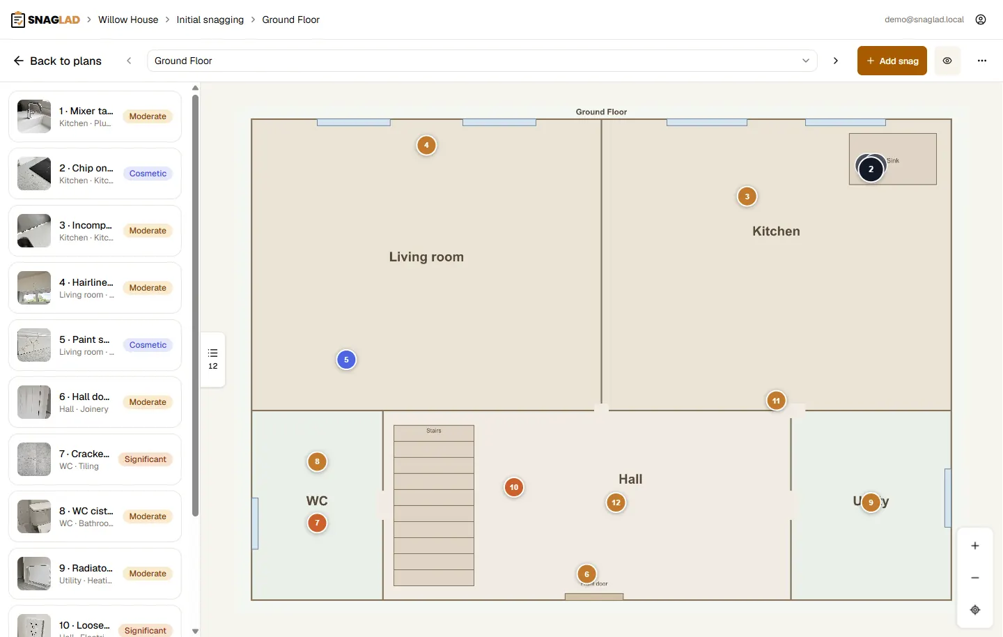 Desktop view of a floor plan in Snaglad with numbered snag pins on the rooms.